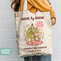 a woman holding a tote bag that says side by side under the lights