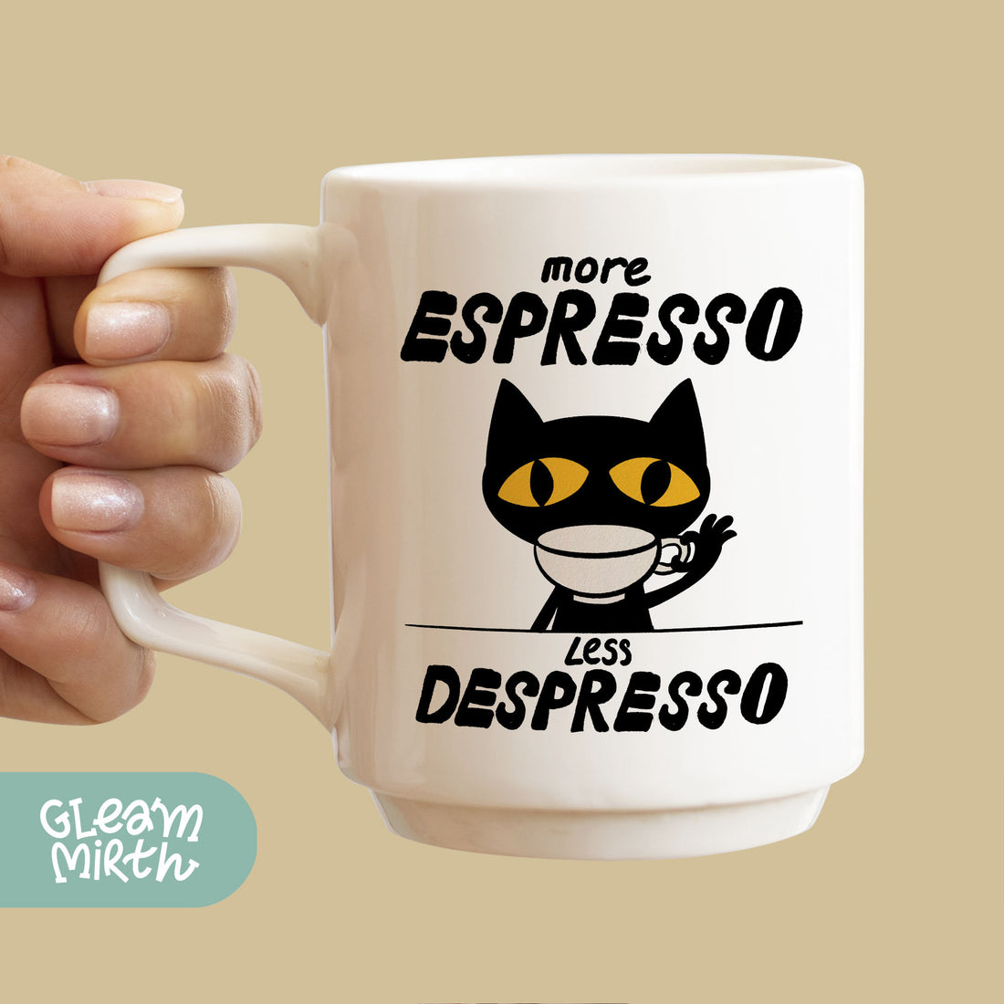 a person holding a coffee mug with a cat on it