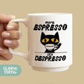 a person holding a coffee mug with a cat on it