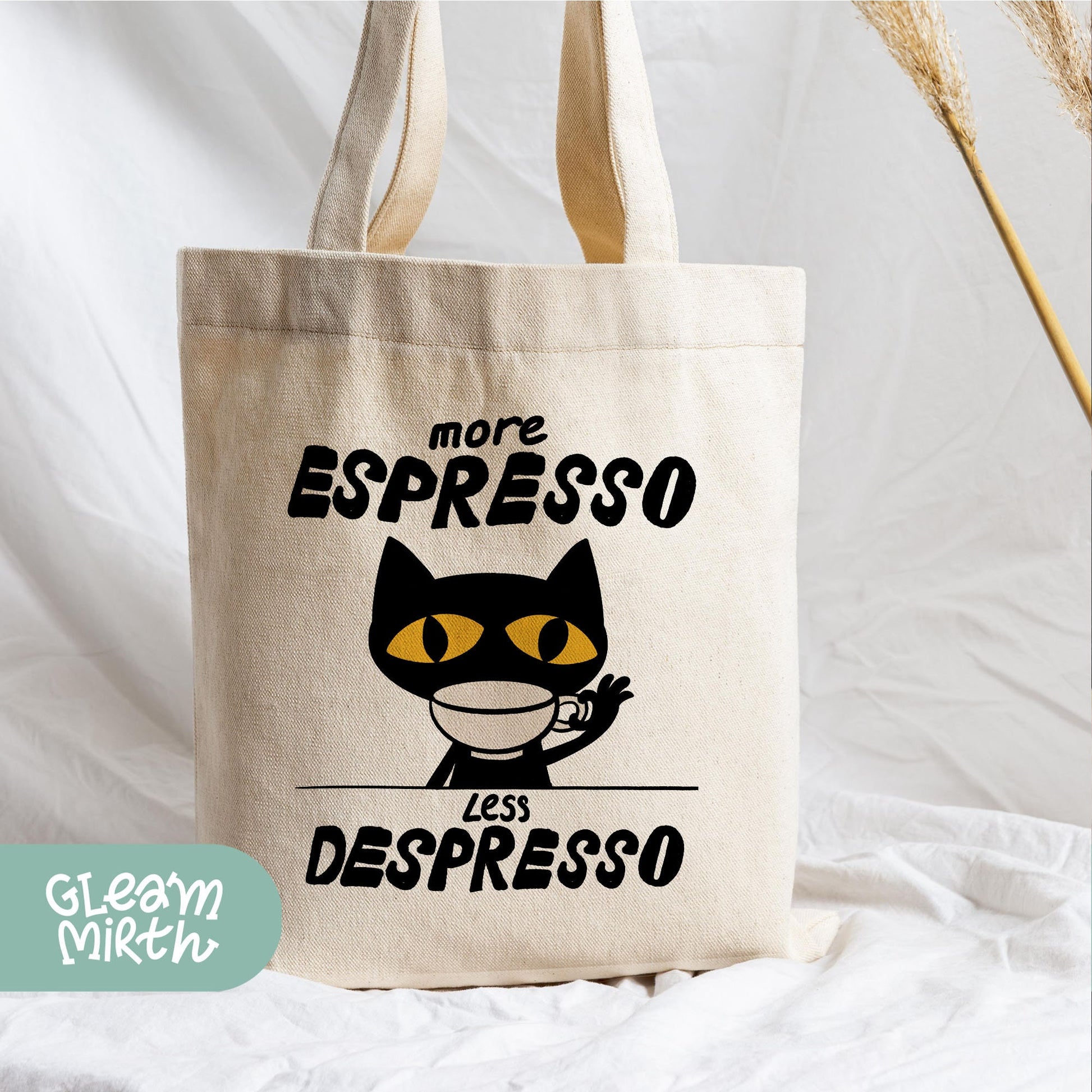 a canvas bag with a black cat on it