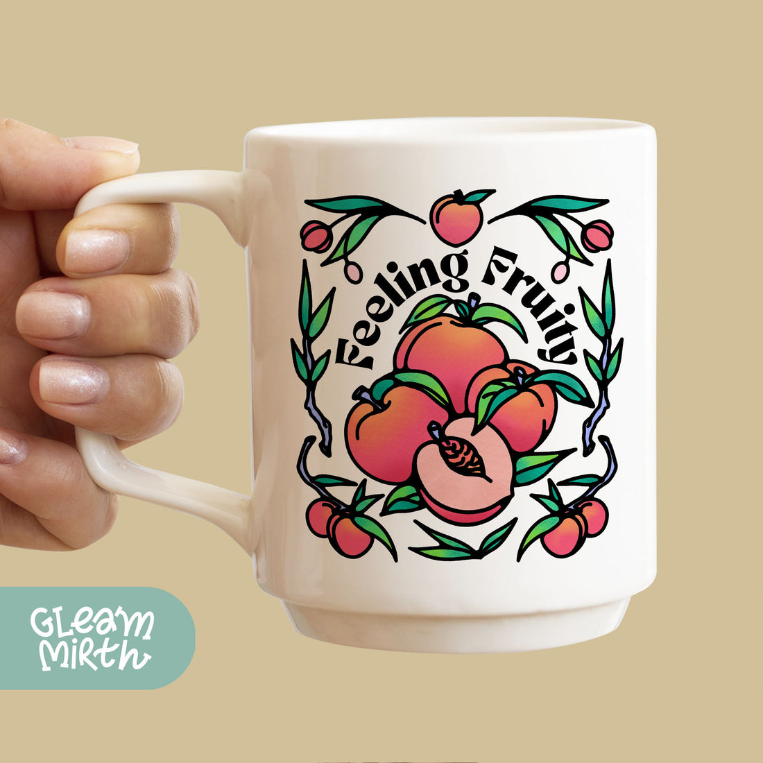 a hand holding a coffee mug with a peach on it