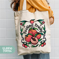a woman holding a white bag with fruit on it