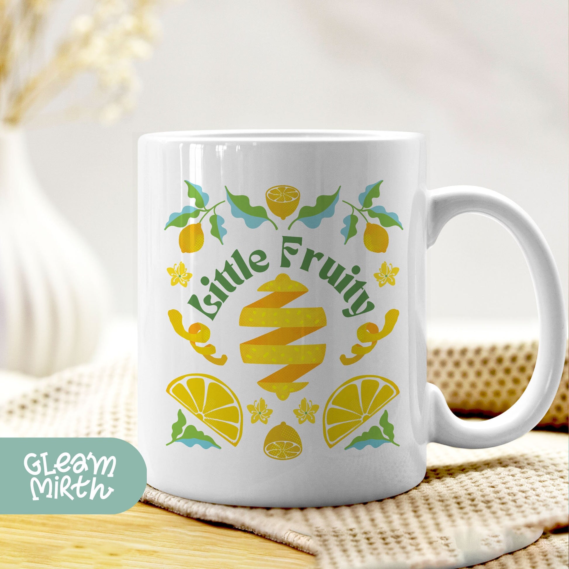 a white coffee mug with the words little fruit on it