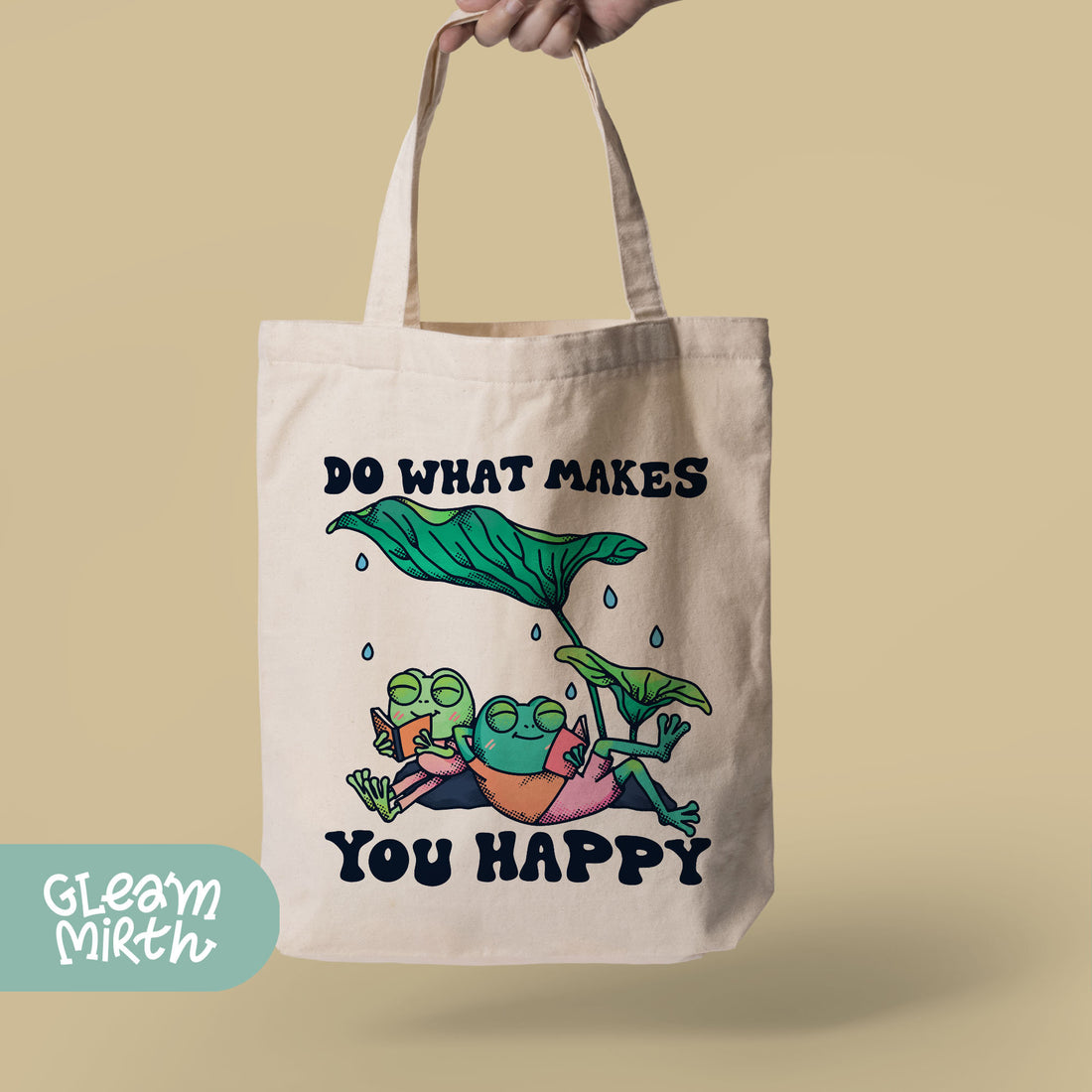 a hand holding a tote bag that says do what makes you happy