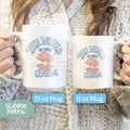 a woman holding two coffee mugs with the words, the world is your oyster