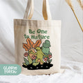 a tote bag with a picture of a frog and flowers on it