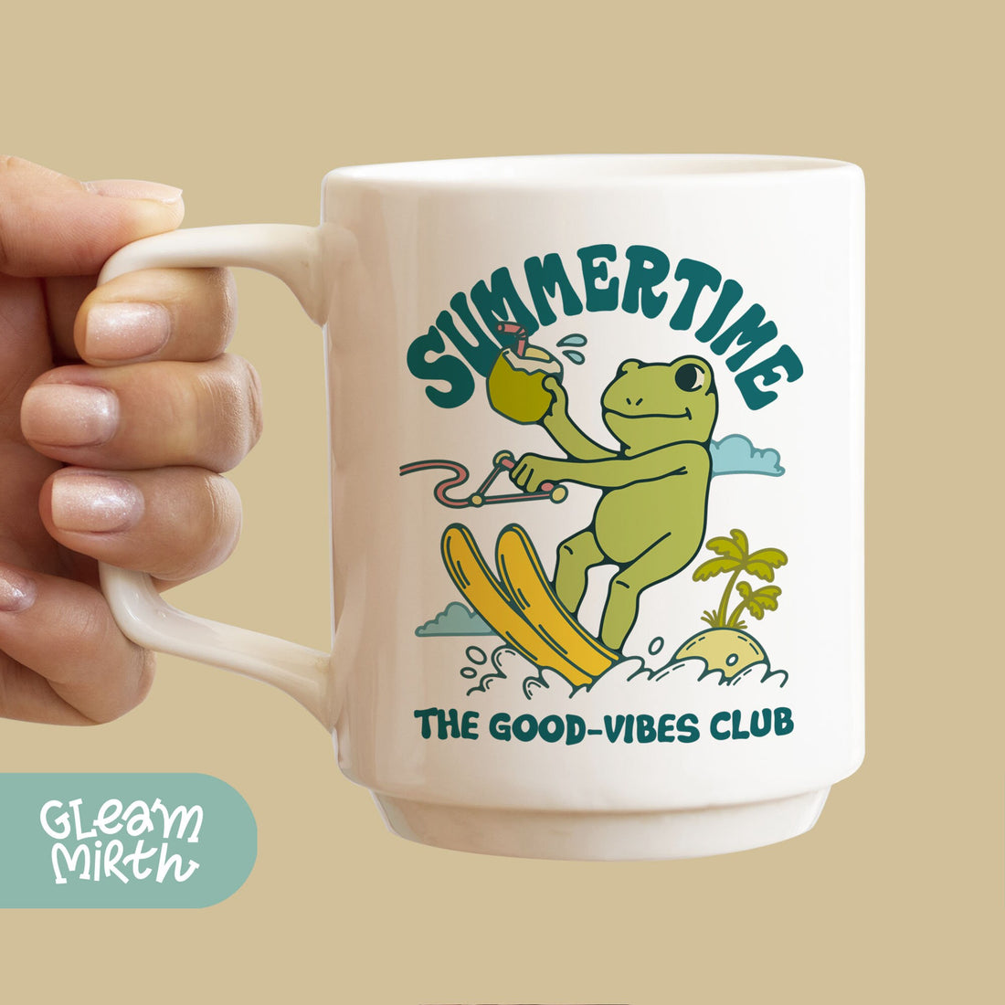 a person holding a coffee mug with a frog on it