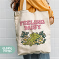 a person holding a bag with a frog on it