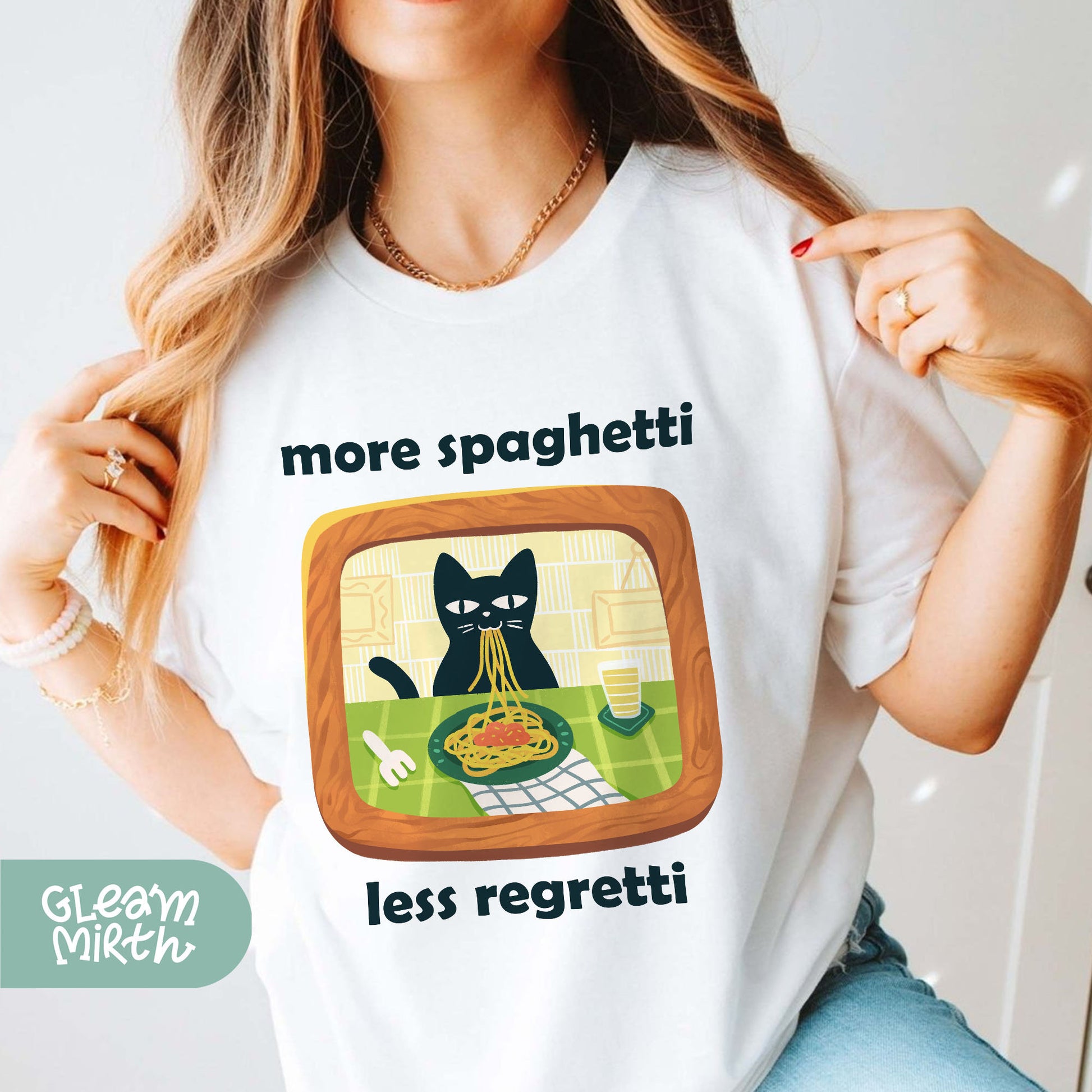 a woman wearing a t - shirt with a cat on it