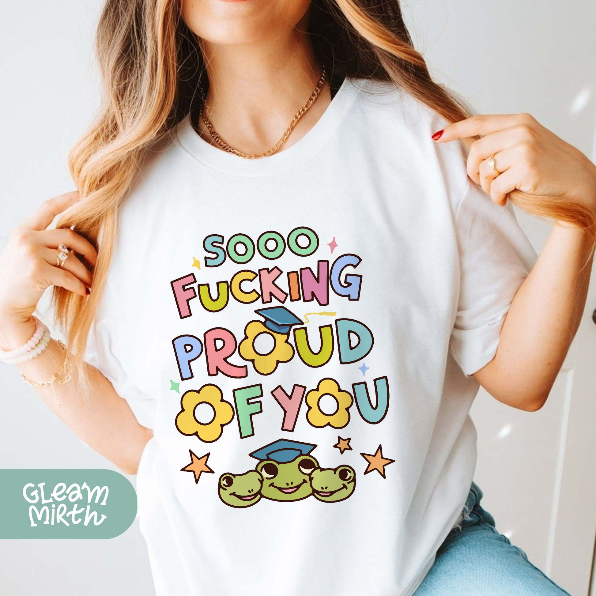 a woman wearing a t - shirt that says, sooo fucking proud of you