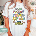 a woman wearing a t - shirt that says, goo fucking proud of you