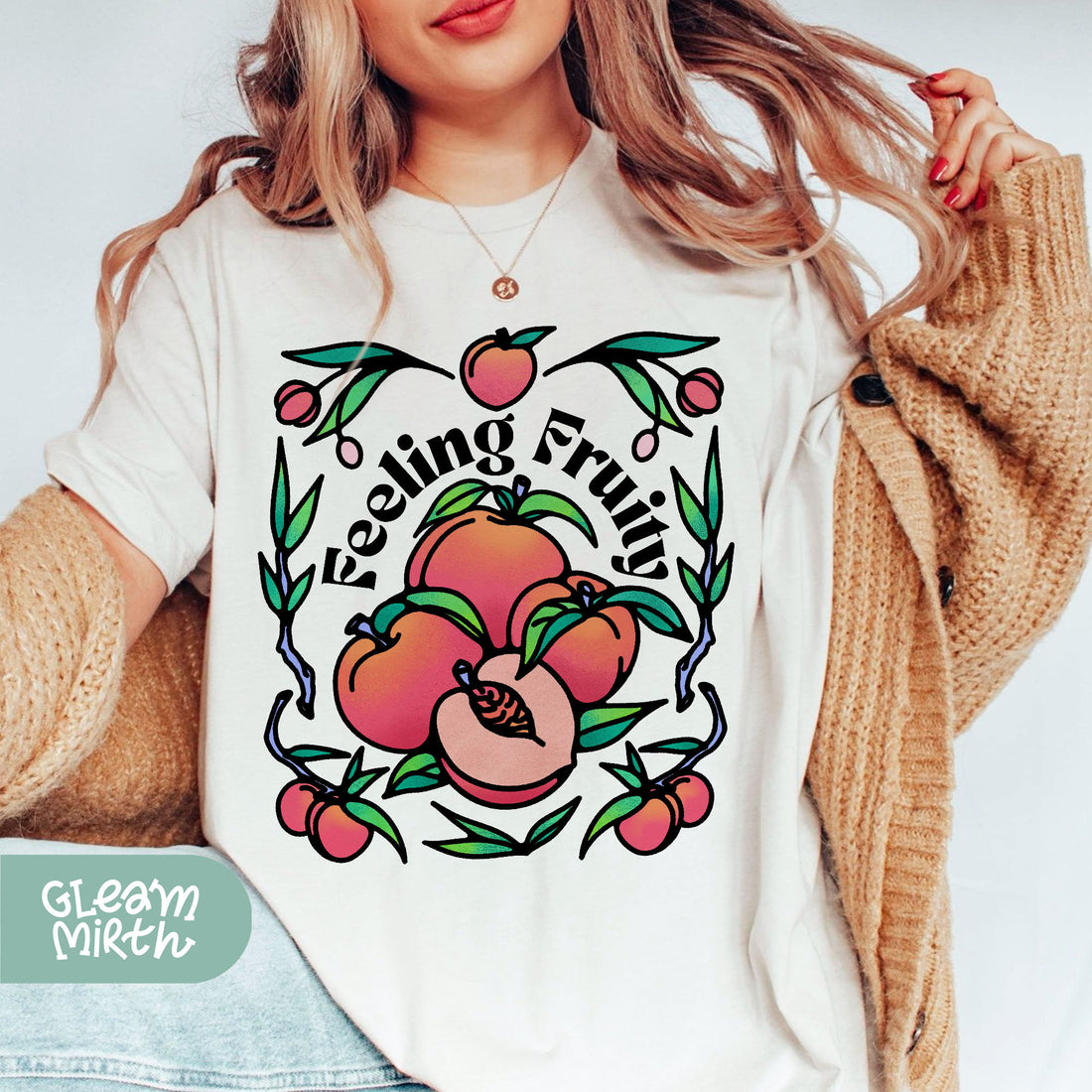 a woman wearing a white tshirt with a flower design