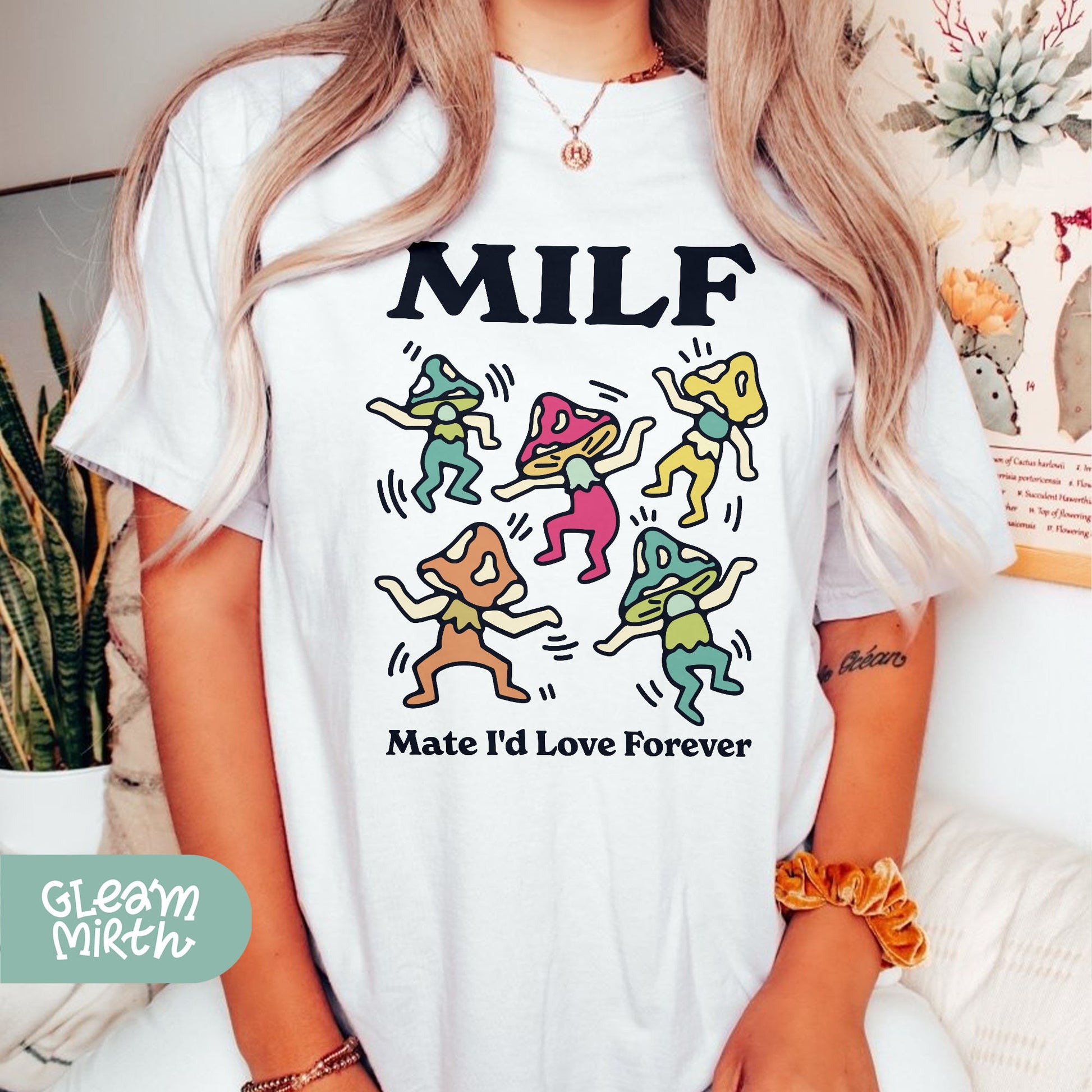 a woman wearing a t - shirt that says milf make i love forever