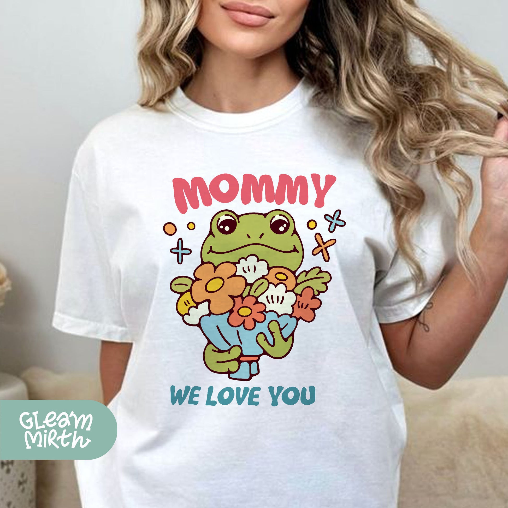 a woman wearing a t - shirt that says mommy we love you