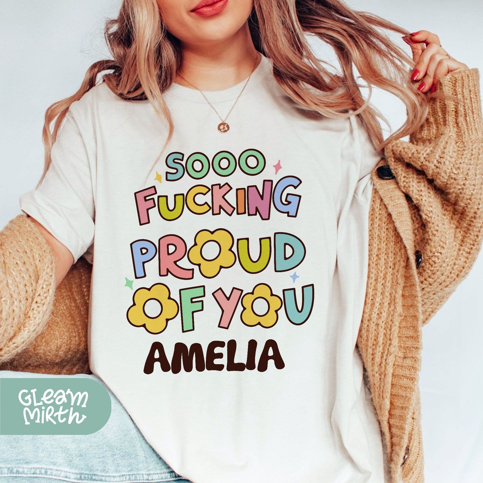 a woman wearing a t - shirt that says, soo fucking proud of you am