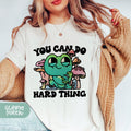 a woman wearing a t - shirt that says you can do hard thing