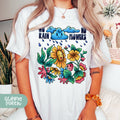 a woman wearing a t - shirt with flowers on it