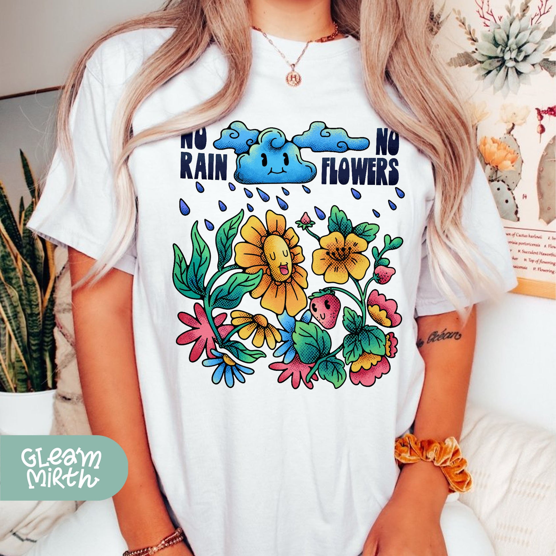 a woman wearing a t - shirt with flowers on it