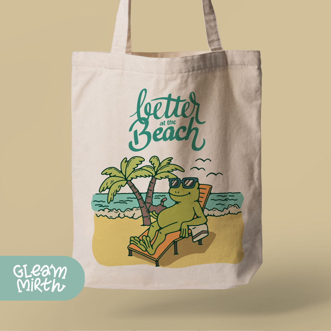 a tote bag with a picture of a frog on a beach