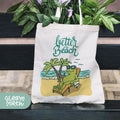 a tote bag sitting on top of a wooden bench