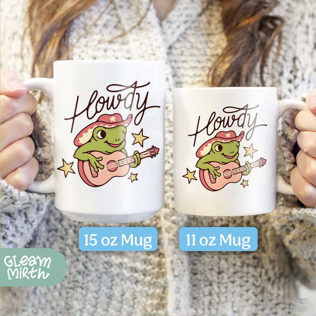 a person holding a coffee mug with a frog on it