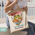 a woman sitting on a bench holding a tote bag