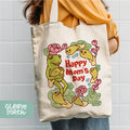 a woman holding a happy mom's day tote bag