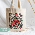 a tote bag with a flower design on it