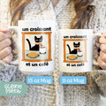 a woman holding two coffee mugs with cats on them