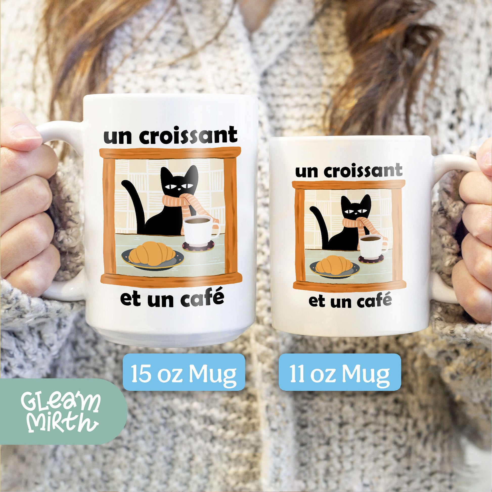 a woman holding two coffee mugs with cats on them