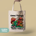 a person holding a bag that says good things take time