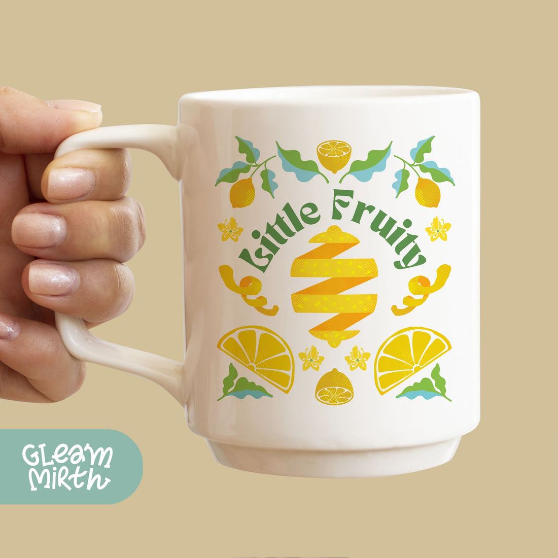 a person holding a coffee mug with a lemon design on it