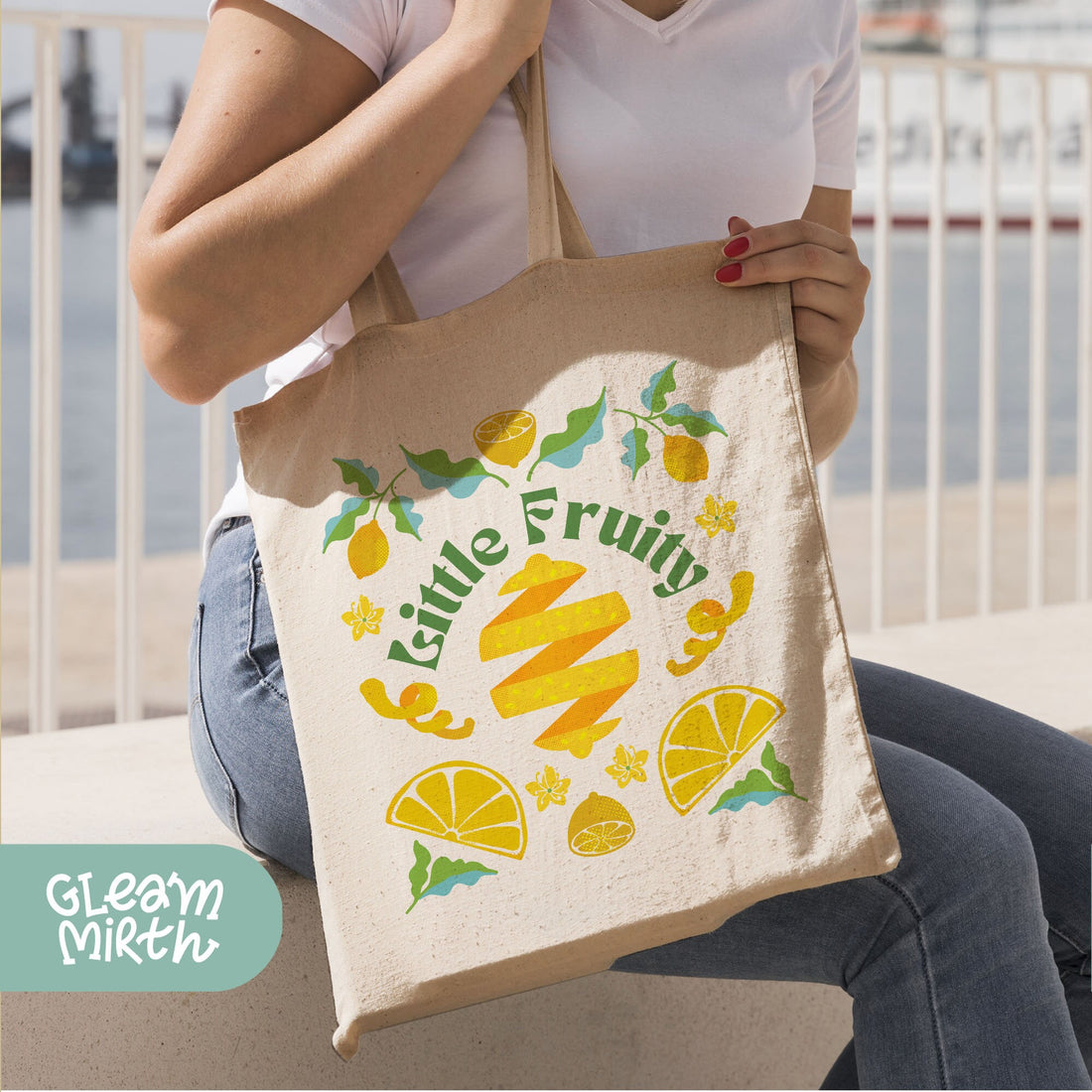 a person holding a bag that says little fruit