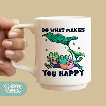 a hand holding a coffee mug with a picture of a plant on it