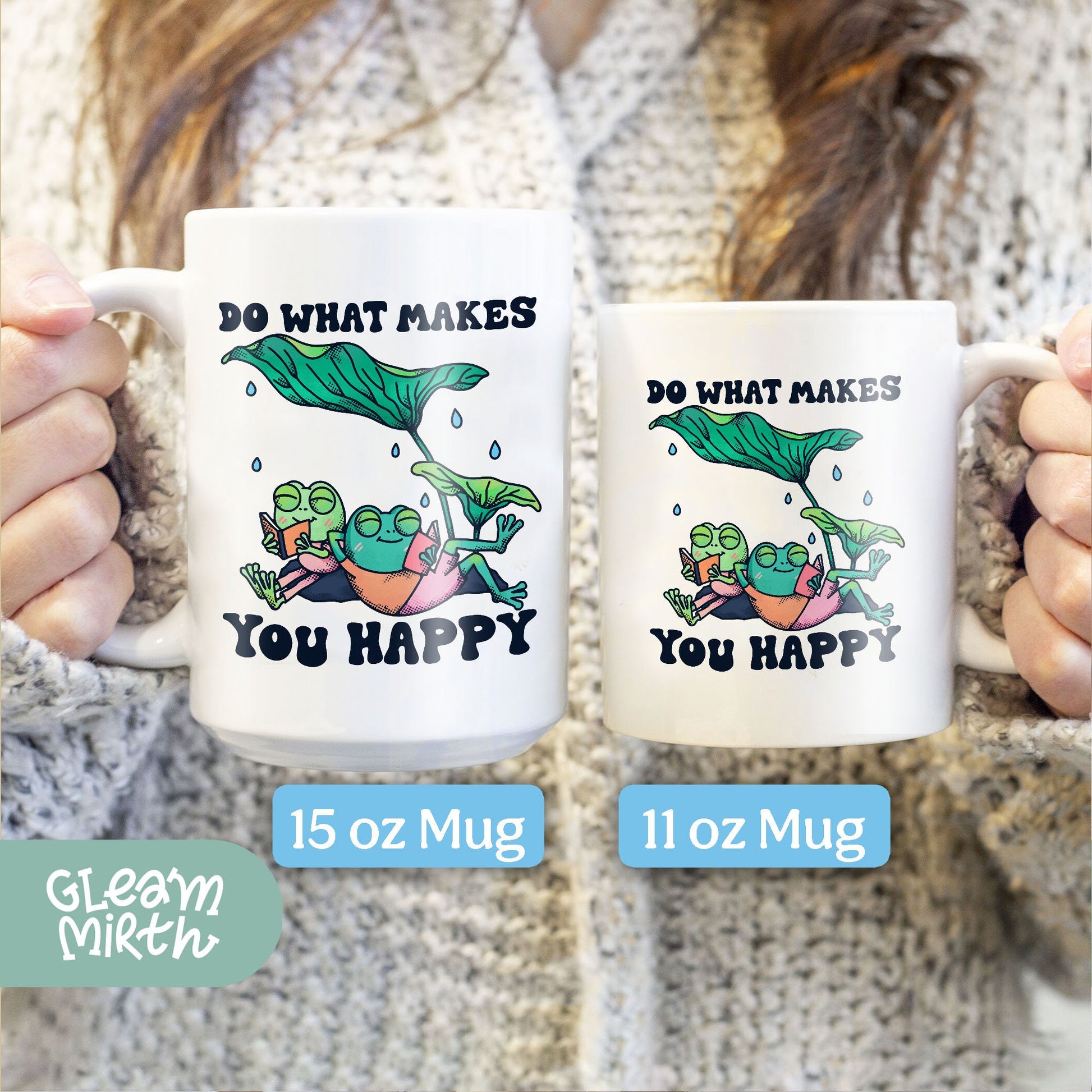 a woman holding two coffee mugs that say do what makes you happy