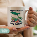 a woman holding a coffee mug with a green plant on it