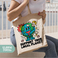 a woman holding a bag with a cartoon character on it