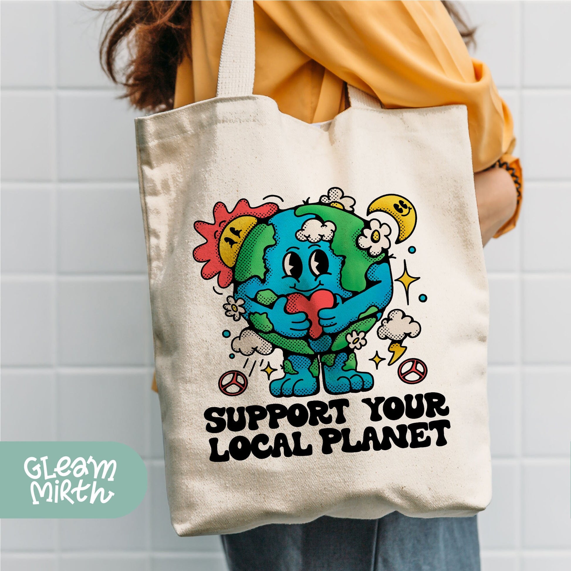 a person holding a tote bag that says support your local planet