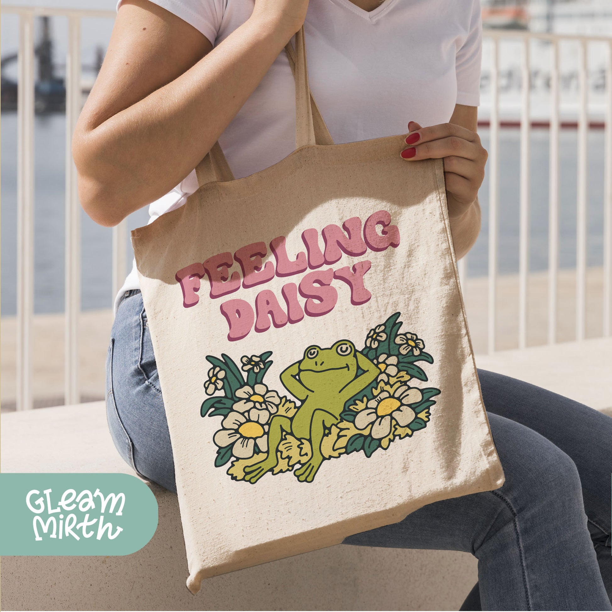 a woman holding a bag with a frog on it