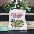 a bag with a frog on it sitting on a bench