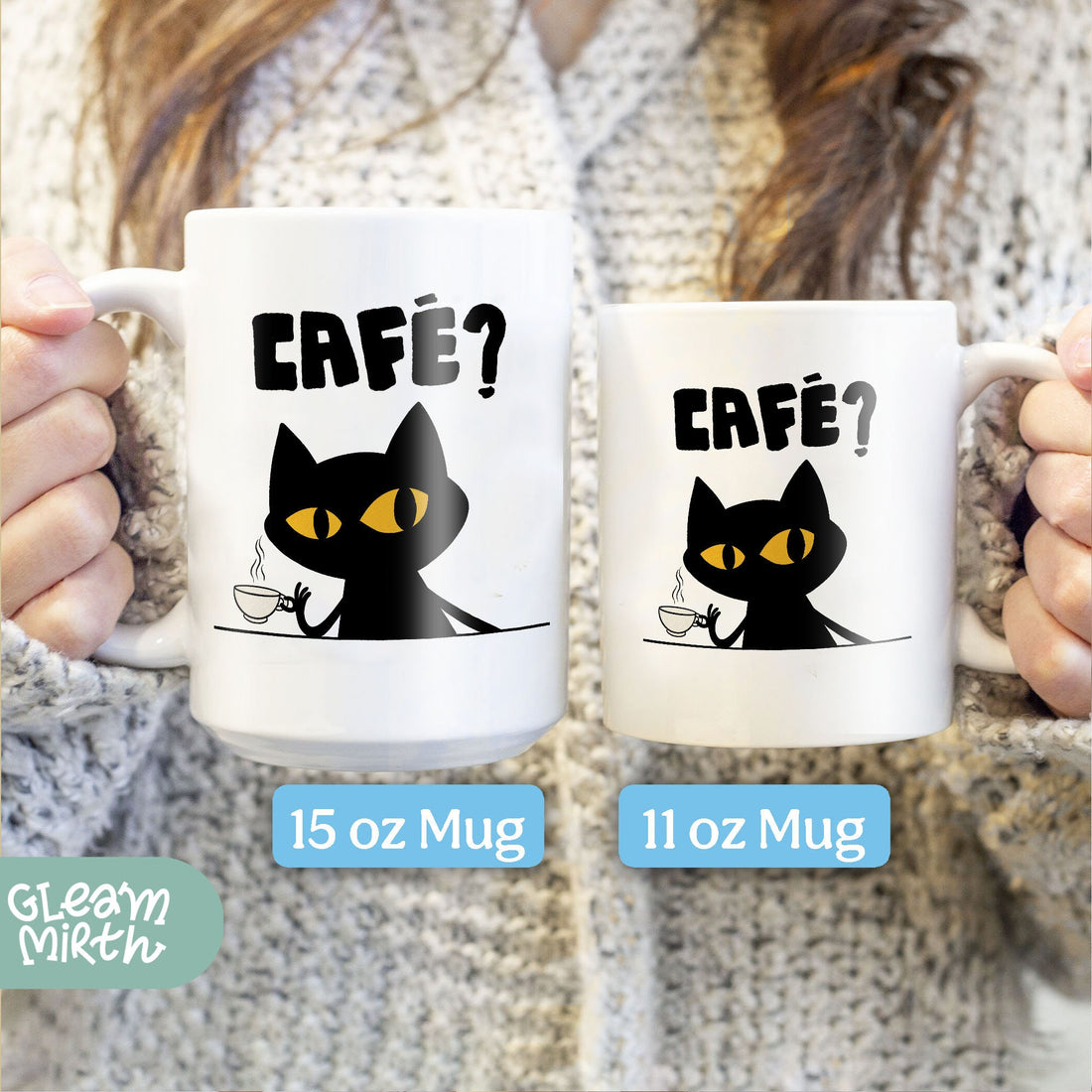 a person holding a coffee mug with a cat on it