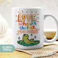 a white coffee mug with a frog on it