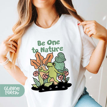 a woman wearing a t - shirt that says be one to nature