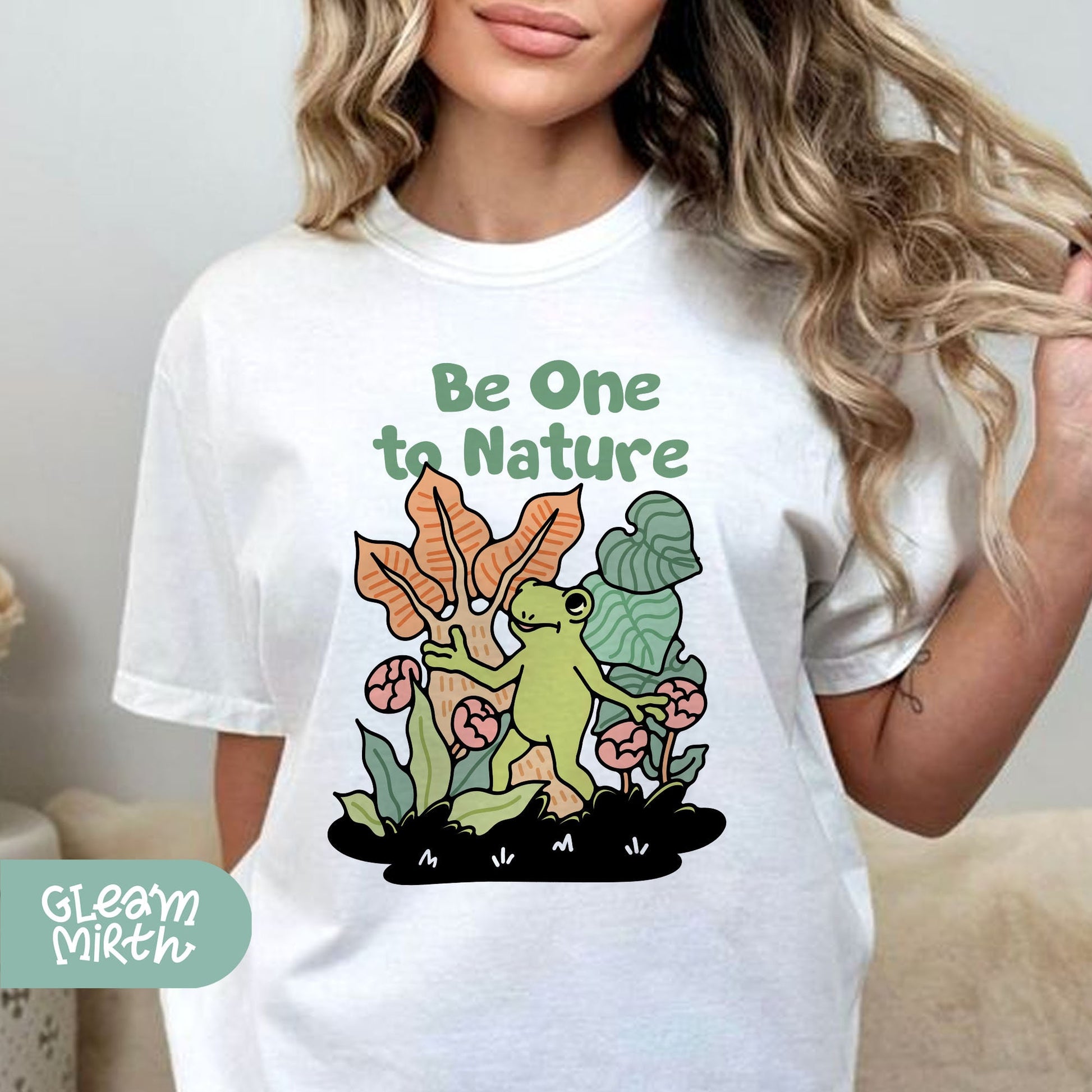 a woman wearing a t - shirt that says be one to nature