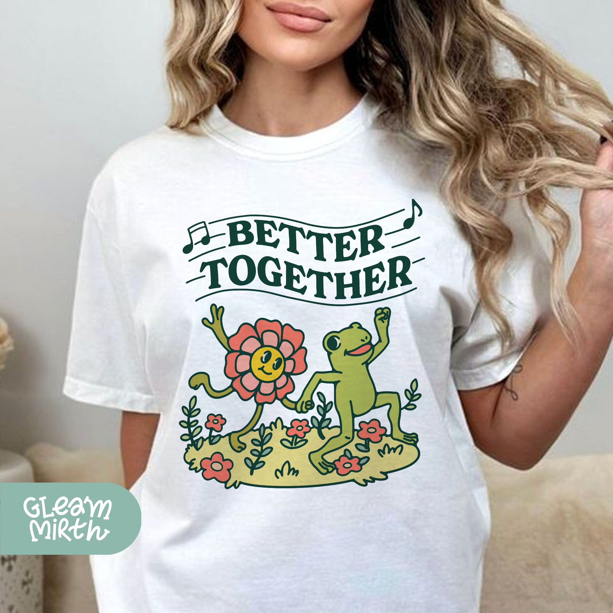 a woman wearing a t - shirt that says better together