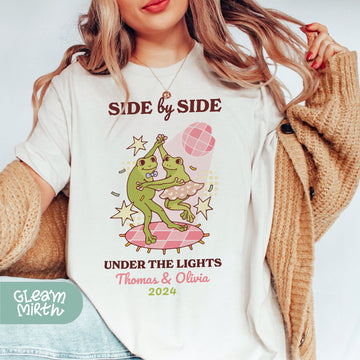 a woman wearing a white t - shirt with a dinosaur on it