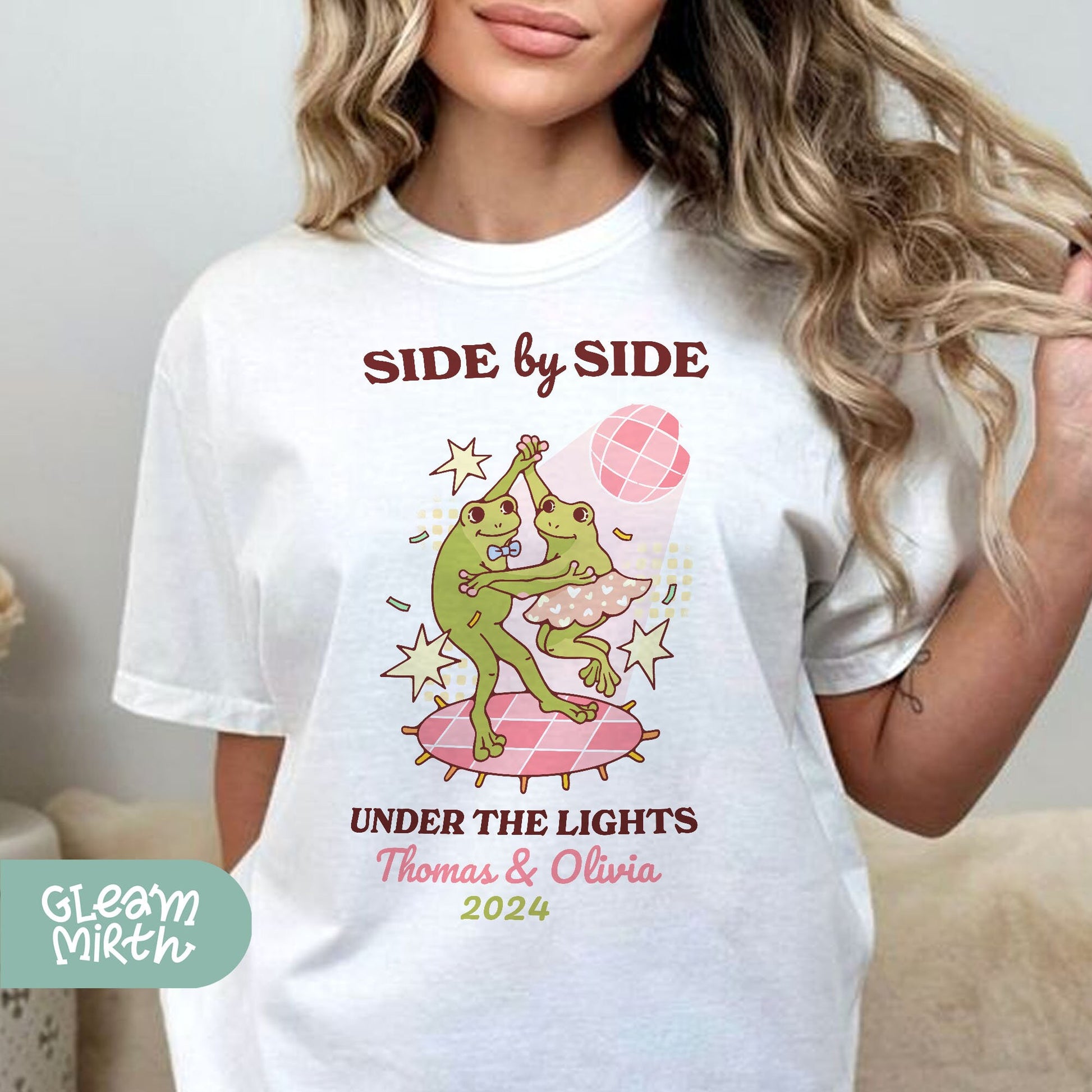 a woman wearing a t - shirt that says side by side under the lights