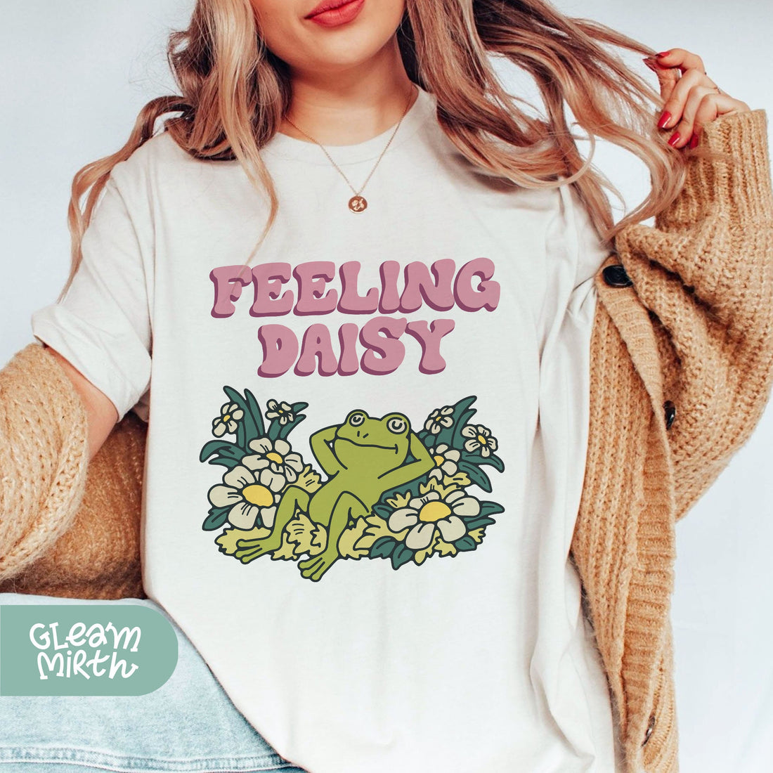 a woman wearing a t - shirt that says feeling daisy