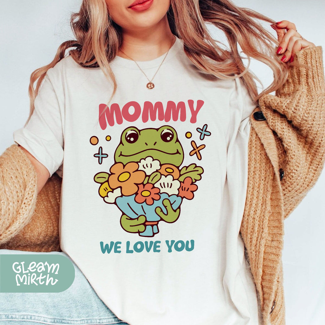 a woman wearing a t - shirt that says mommy we love you