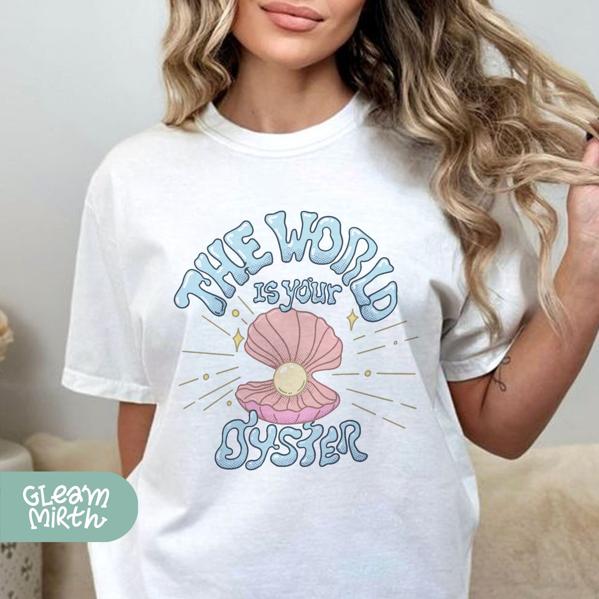 a woman wearing a white t - shirt that says the world is your oyster